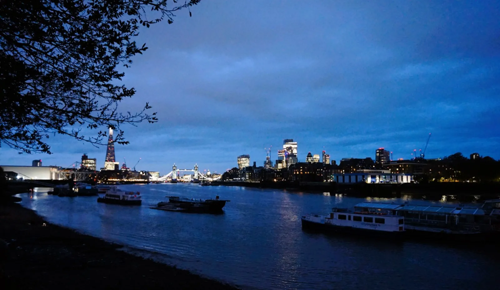 The Shard and Tower Bridge on the River Thames at dusk