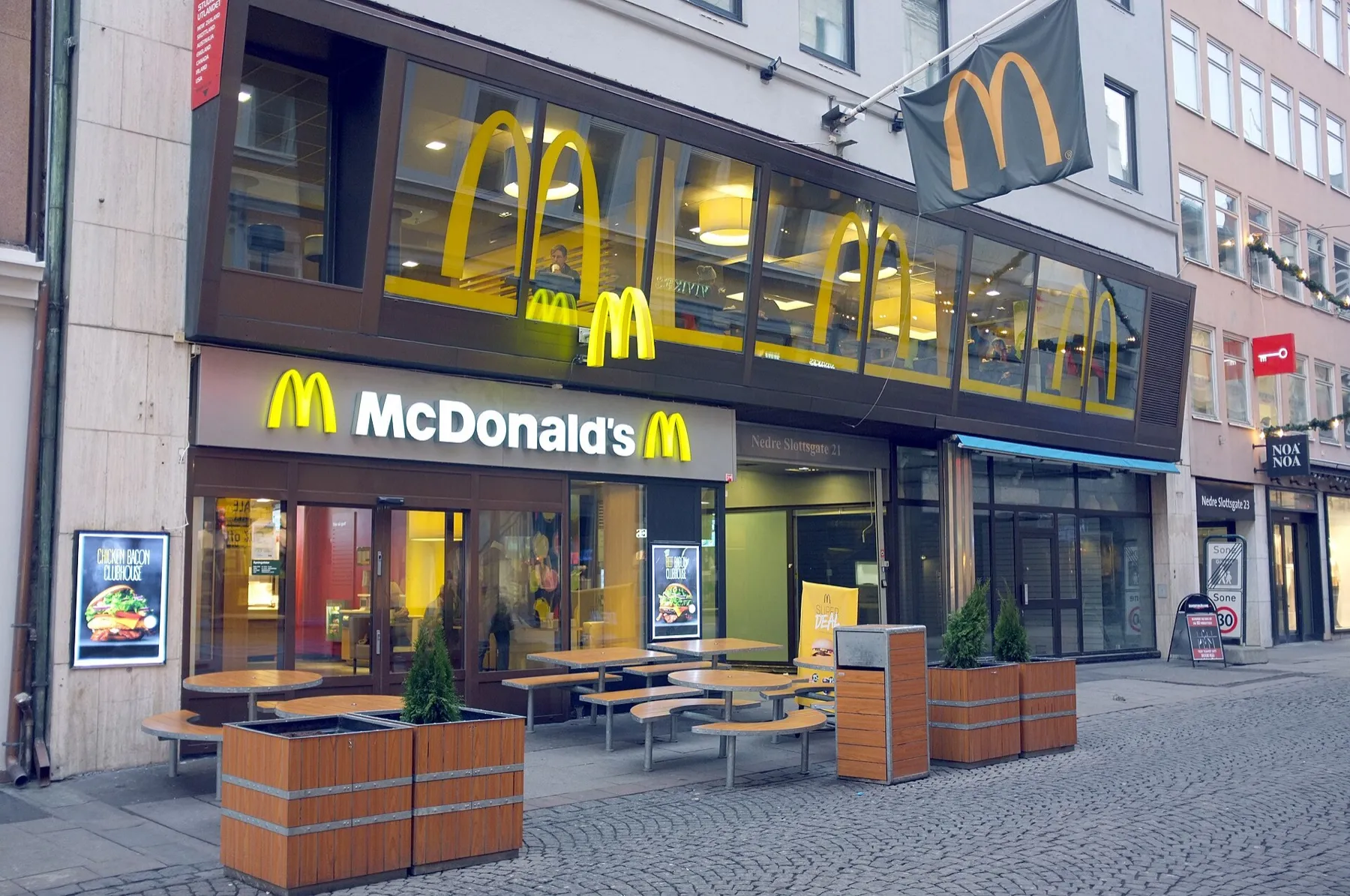 A McDonald’s with outdoor seating on a pedestrian street in Oslo