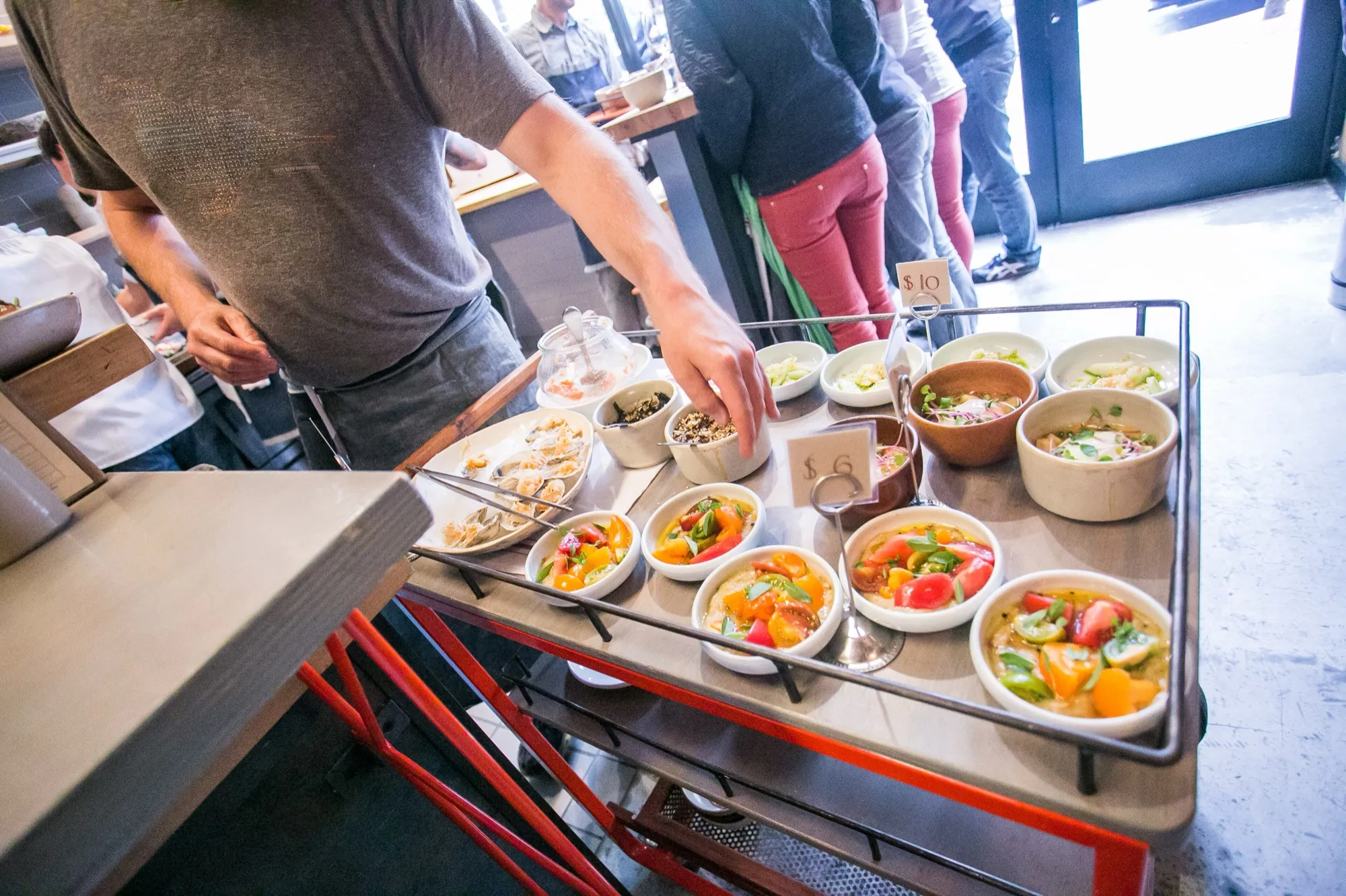 A dim sum-style cart of small plates at State Bird Provisions in San Francisco