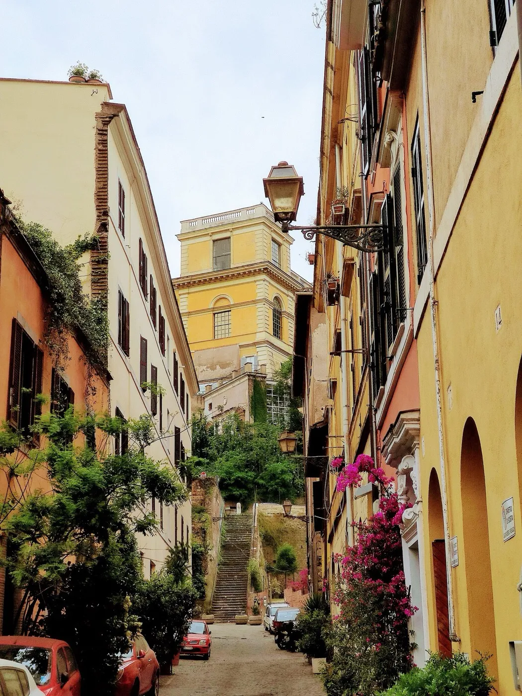 A narrow street of ochre buildings in Trastevere