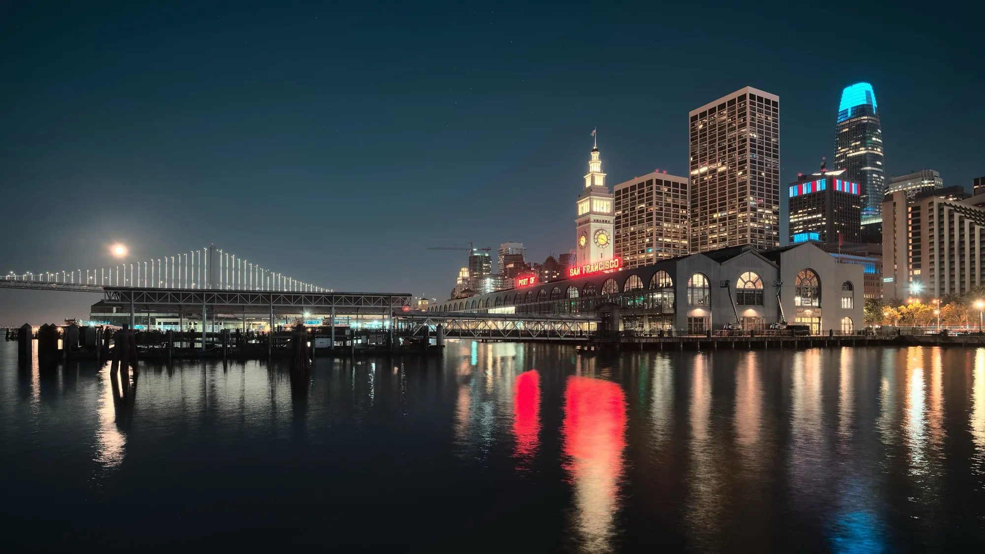 The Ferry Building at night with the Bay Bridge