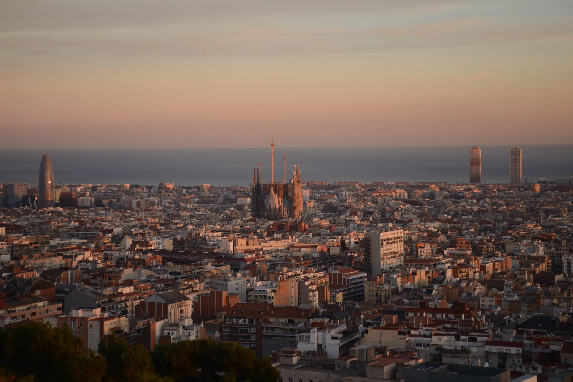 Barcelona at sunset seen from Park Güell, with the Sagrada Família in the center